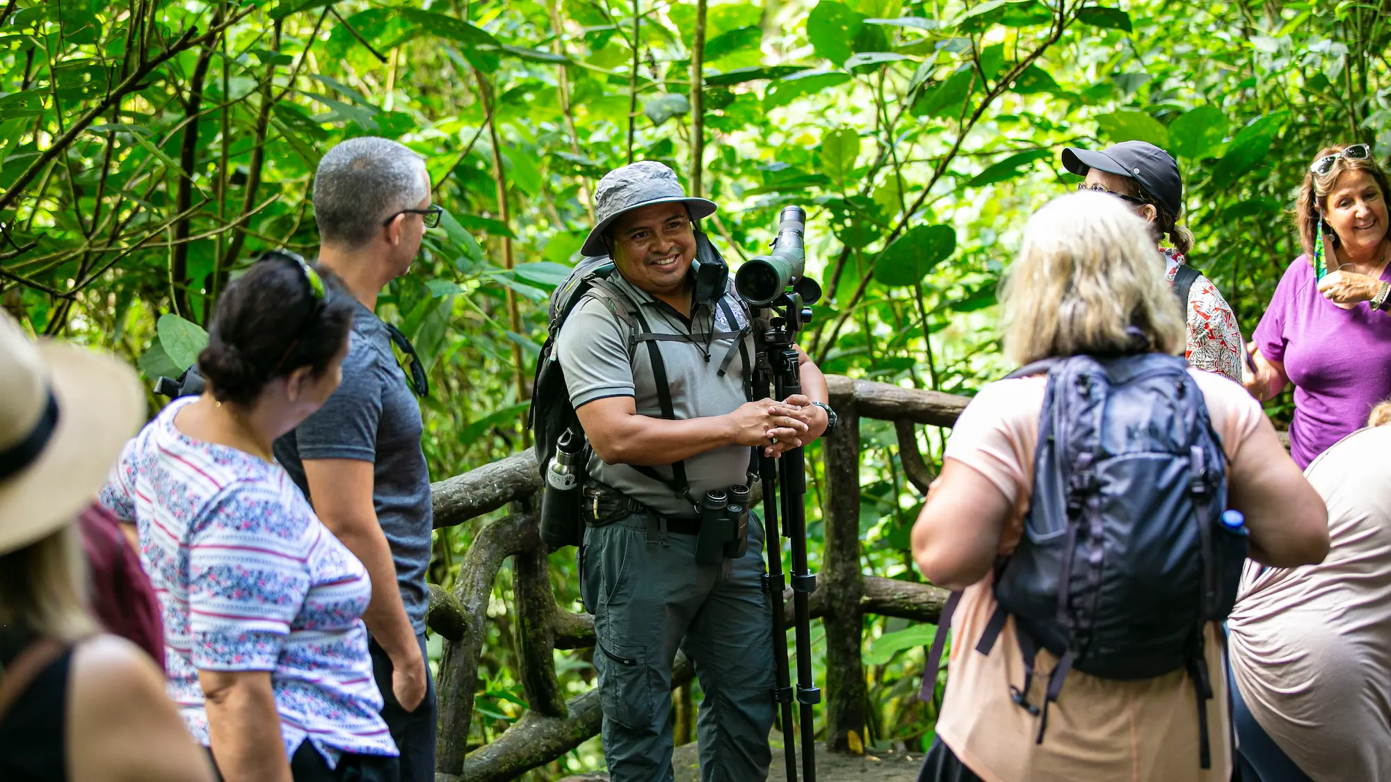 Travel guide leading a group through the jungle.