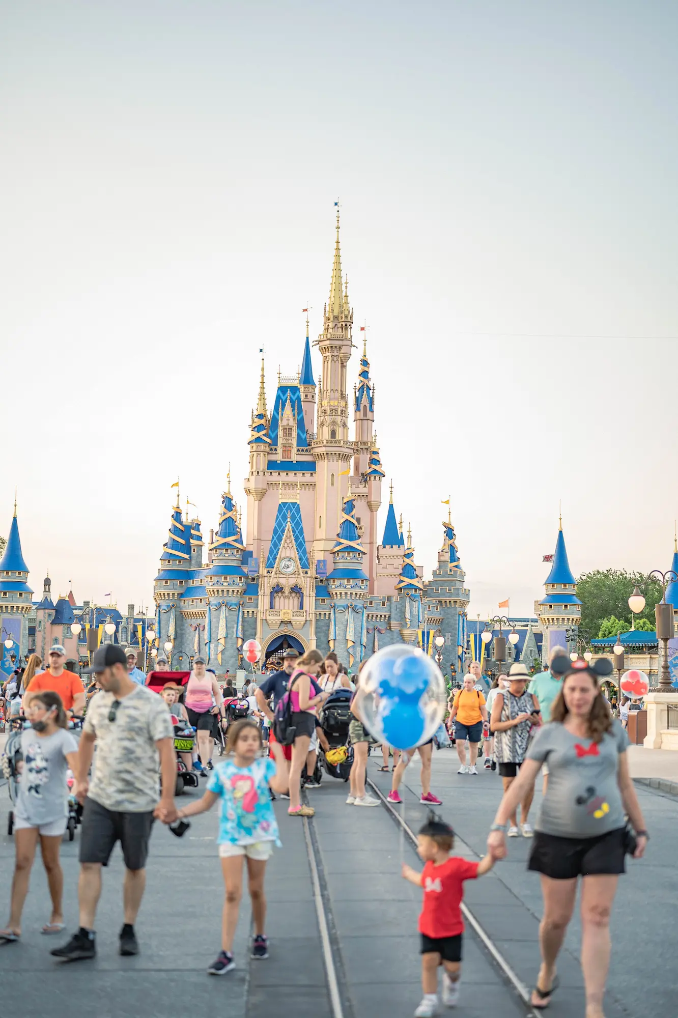 A crowd of people in front of Disney World Resort