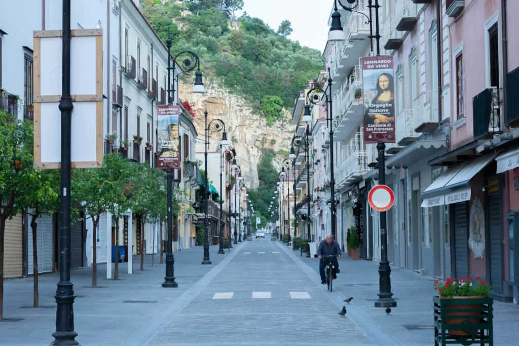 Picturesque Sorrento coastline with cliffs and historic buildings.